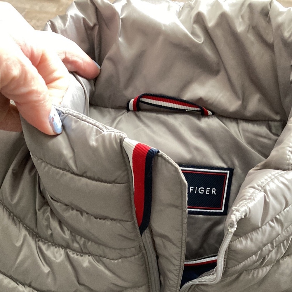 Grey vest that is slightly a puffer, has an all blue inside.  Tommy Hilfiger